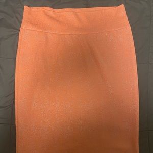Orange pencil skirt with silver “glitter” look